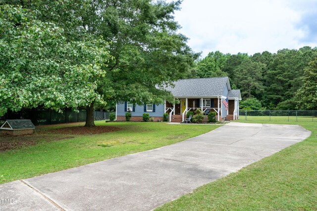 1008 Catsby Cir, Raleigh, NC 27603 - view of front of property with covered porch, driveway, and roof with shingles