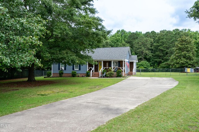 1008 Catsby Cir, Raleigh, NC 27603 - view of front of house with a porch, concrete driveway, and roof with shingles