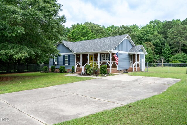 1008 Catsby Cir, Raleigh, NC 27603 - single story home featuring crawl space, a porch, concrete driveway, board and batten siding, and a shingled roof