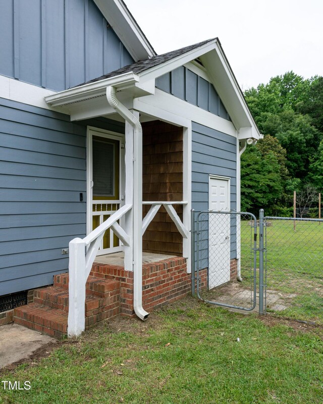 1008 Catsby Cir, Raleigh, NC 27603 - entrance to property featuring board and batten siding and crawl space