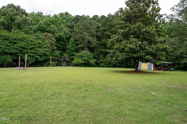 1008 Catsby Cir, Raleigh, NC 27603 - view of grassy yard with a shed