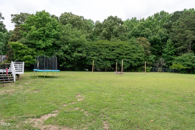 1008 Catsby Cir, Raleigh, NC 27603 - view of yard featuring a trampoline and a deck