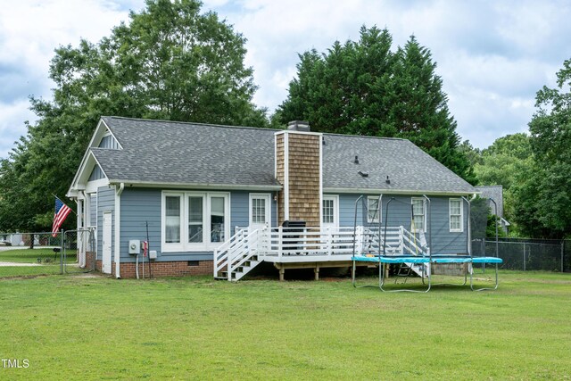 1008 Catsby Cir, Raleigh, NC 27603 - rear view of property with a deck, roof with shingles, a trampoline, a chimney, and crawl space