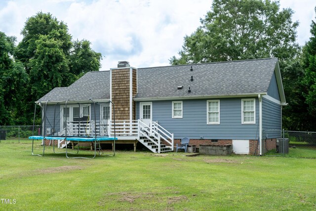 1008 Catsby Cir, Raleigh, NC 27603 - back of house featuring a shingled roof, a chimney, a trampoline, and crawl space