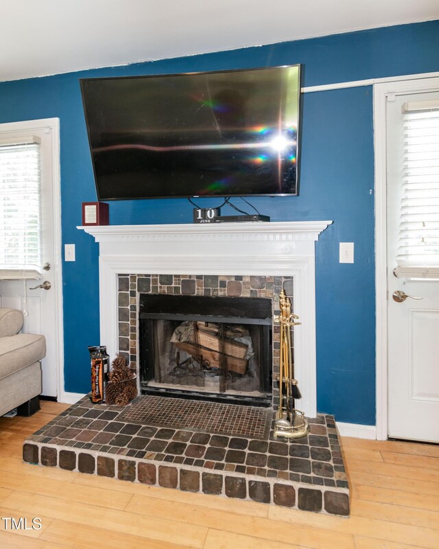 1008 Catsby Cir, Raleigh, NC 27603 - detailed view of a fireplace with raised hearth and wood finished floors