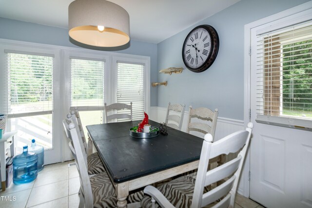 1008 Catsby Cir, Raleigh, NC 27603 - dining space with a wainscoted wall and light tile patterned floors