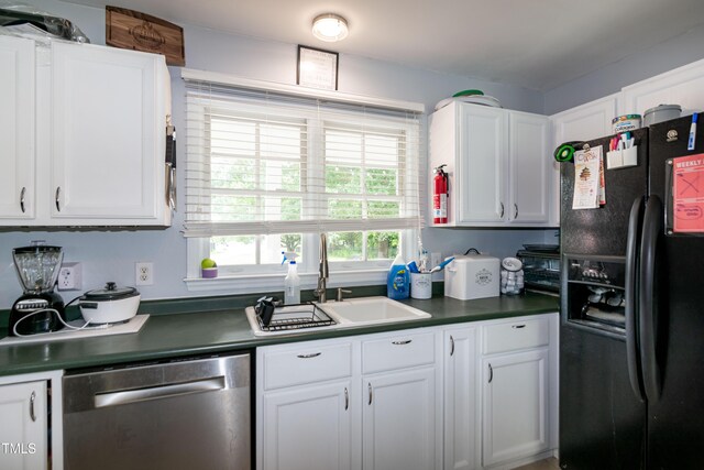 1008 Catsby Cir, Raleigh, NC 27603 - kitchen with black fridge with ice dispenser, dishwasher, white cabinetry, and dark countertops