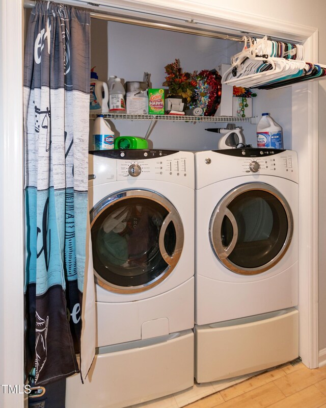 1008 Catsby Cir, Raleigh, NC 27603 - laundry room featuring washer and dryer and light wood-type flooring