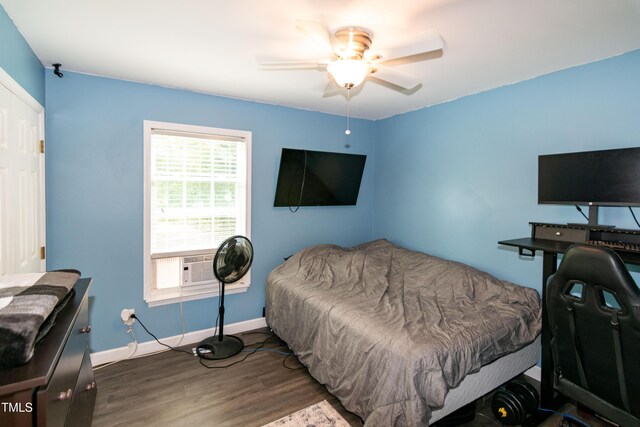 1008 Catsby Cir, Raleigh, NC 27603 - bedroom featuring wood finished floors, a ceiling fan, and cooling unit