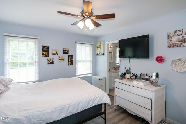 1008 Catsby Cir, Raleigh, NC 27603 - bedroom featuring wood finished floors, connected bathroom, and ceiling fan