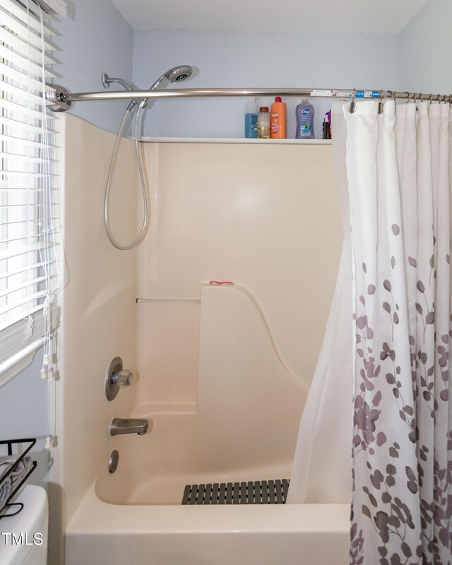 1008 Catsby Cir, Raleigh, NC 27603 - bathroom featuring shower / bathtub combination with curtain