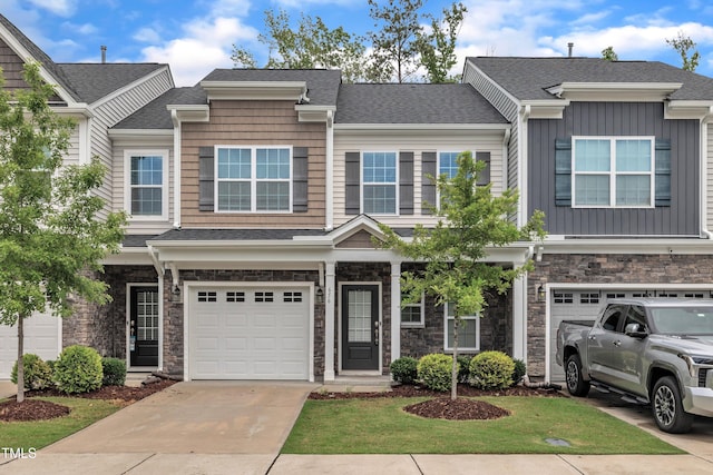 656 Barneswyck Dr, Fuquay Varina, NC 27526 - townhome / multi-family property with an attached garage, board and batten siding, concrete driveway, stone siding, and a shingled roof