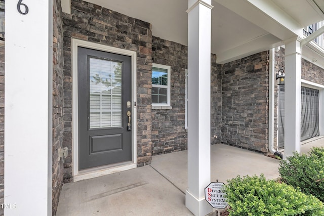 656 Barneswyck Dr, Fuquay Varina, NC 27526 - property entrance featuring stone siding and a porch