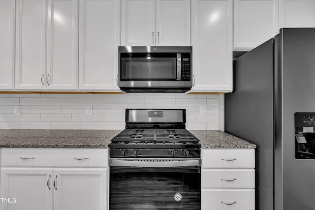 656 Barneswyck Dr, Fuquay Varina, NC 27526 - kitchen featuring stainless steel appliances, white cabinetry, and decorative backsplash