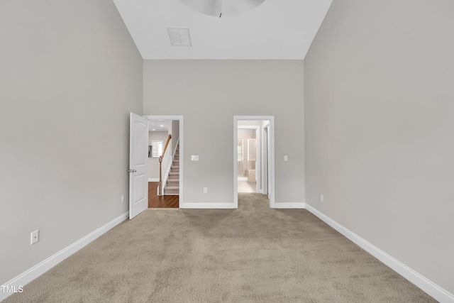 656 Barneswyck Dr, Fuquay Varina, NC 27526 - unfurnished bedroom with high vaulted ceiling, carpet floors, and connected bathroom