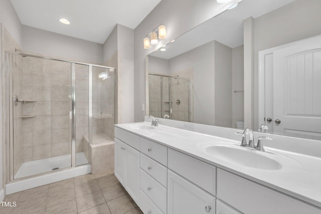 656 Barneswyck Dr, Fuquay Varina, NC 27526 - bathroom with double vanity, a shower stall, and tile patterned flooring