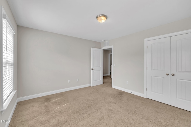 656 Barneswyck Dr, Fuquay Varina, NC 27526 - unfurnished bedroom featuring carpet flooring and a closet