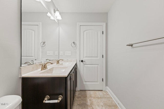 509 Holden Forest Dr, Youngsville, NC 27596 - bathroom with double vanity and baseboards