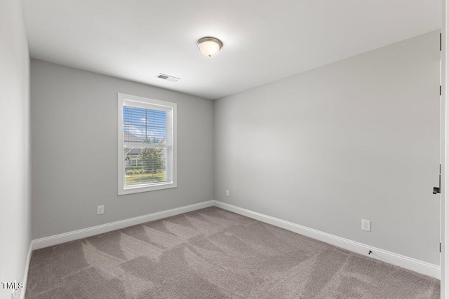 509 Holden Forest Dr, Youngsville, NC 27596 - carpeted empty room with baseboards