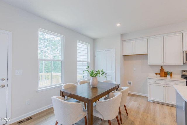1359 Chowan Ave, Durham, NC 27713 - dining area featuring light wood-style flooring and recessed lighting