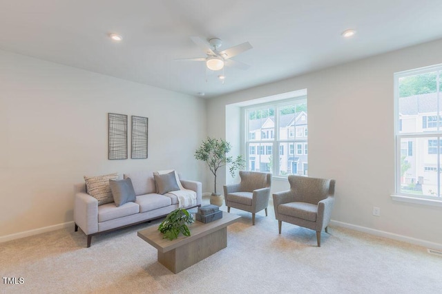 1359 Chowan Ave, Durham, NC 27713 - living area with healthy amount of natural light, light colored carpet, ceiling fan, and recessed lighting
