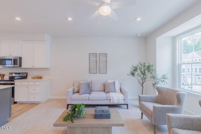 1359 Chowan Ave, Durham, NC 27713 - living room featuring healthy amount of natural light, recessed lighting, ceiling fan, and light colored carpet