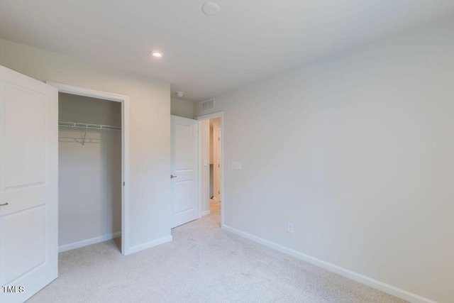1359 Chowan Ave, Durham, NC 27713 - unfurnished bedroom with light carpet, a closet, and recessed lighting