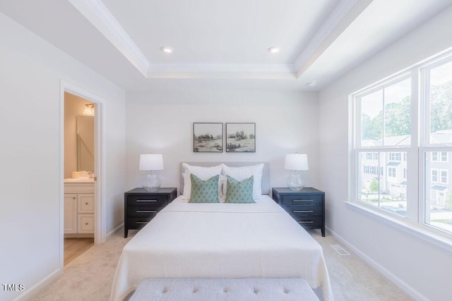 1359 Chowan Ave, Durham, NC 27713 - bedroom featuring light carpet, a tray ceiling, crown molding, recessed lighting, and ensuite bath