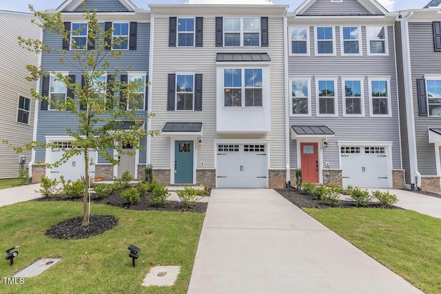 1359 Chowan Ave, Durham, NC 27713 - townhome / multi-family property featuring driveway, a garage, a front yard, and stone siding