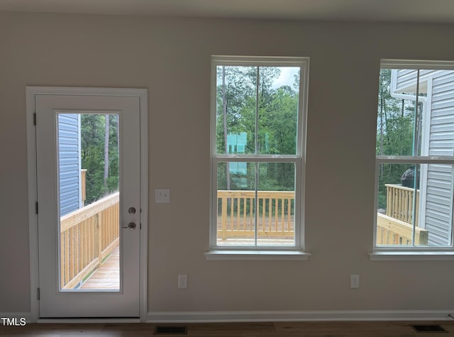 1359 Chowan Ave, Durham, NC 27713 - doorway to outside with healthy amount of natural light and wood finished floors