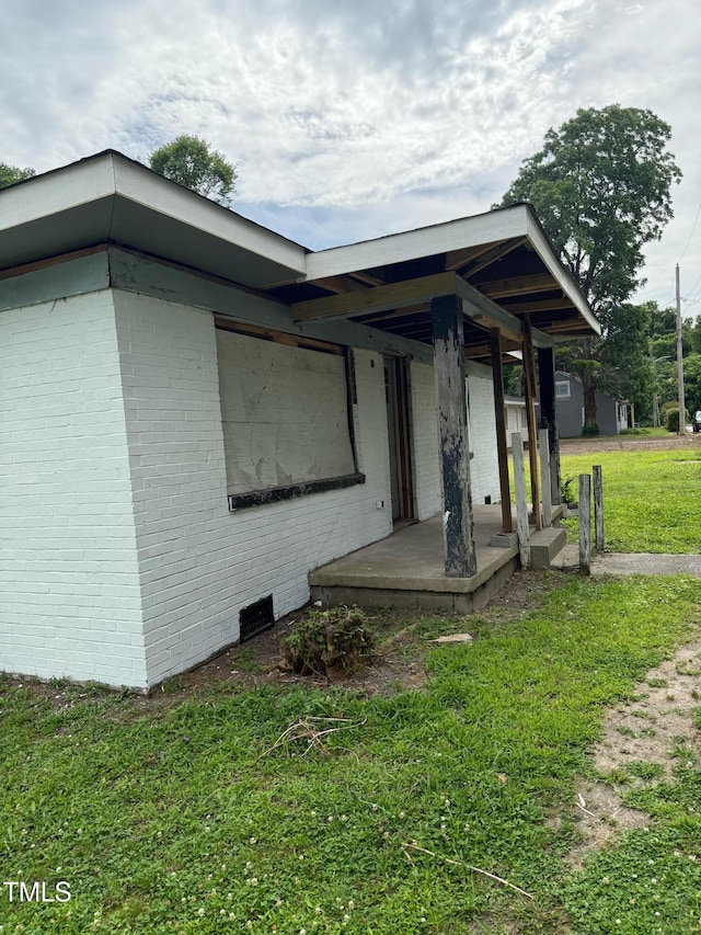 807 Irma St SE, Wilson, NC 27893 - view of front of home with a front yard and brick siding