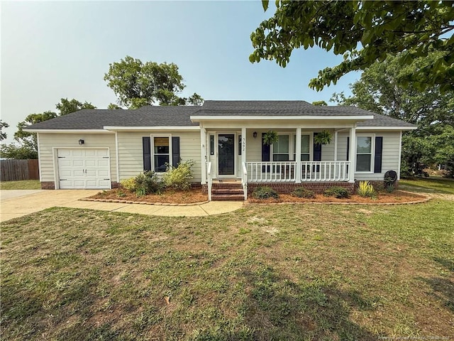 5692 Archer Rd, Hope Mills, NC 28348 - ranch-style home featuring covered porch, an attached garage, and driveway