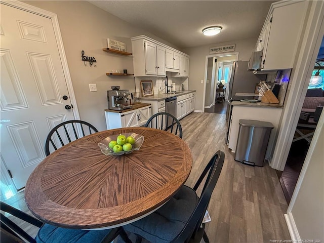 5692 Archer Rd, Hope Mills, NC 28348 - dining space with light wood-style floors and baseboards