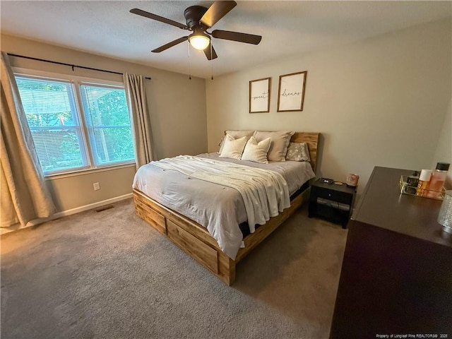 5692 Archer Rd, Hope Mills, NC 28348 - carpeted bedroom featuring a ceiling fan and baseboards