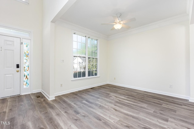 1613 Patterson Grove Rd, Apex, NC 27502 - foyer with ornamental molding, wood finished floors, a ceiling fan, and baseboards