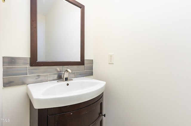 1613 Patterson Grove Rd, Apex, NC 27502 - bathroom featuring vanity and backsplash