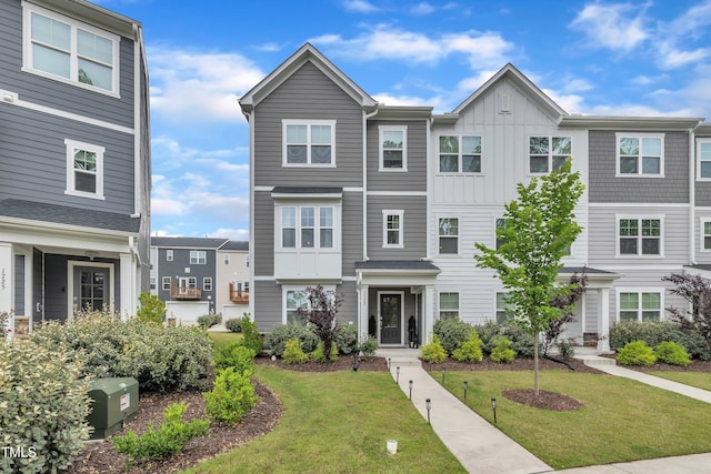 1729 Starlit Sky Ln, Cary, NC 27519 - view of property with board and batten siding and a front lawn
