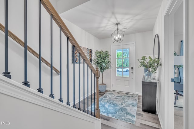 1729 Starlit Sky Ln, Cary, NC 27519 - foyer entrance featuring stairs, wood finished floors, and a chandelier