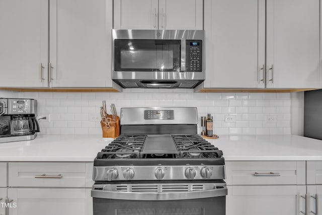 1729 Starlit Sky Ln, Cary, NC 27519 - kitchen featuring appliances with stainless steel finishes, light countertops, and decorative backsplash