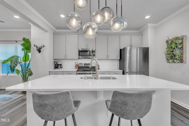 1729 Starlit Sky Ln, Cary, NC 27519 - kitchen featuring appliances with stainless steel finishes, a breakfast bar area, light countertops, backsplash, and ornamental molding