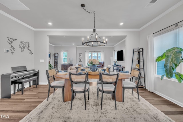 1729 Starlit Sky Ln, Cary, NC 27519 - dining room with wood finished floors, recessed lighting, a chandelier, and ornamental molding