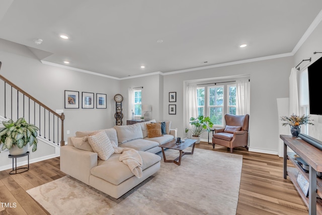 1729 Starlit Sky Ln, Cary, NC 27519 - living area with light wood-type flooring, crown molding, recessed lighting, and stairway
