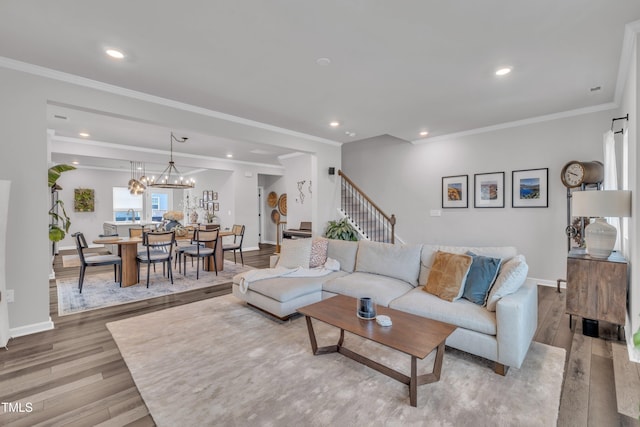1729 Starlit Sky Ln, Cary, NC 27519 - living area with wood finished floors, recessed lighting, stairway, ornamental molding, and a chandelier