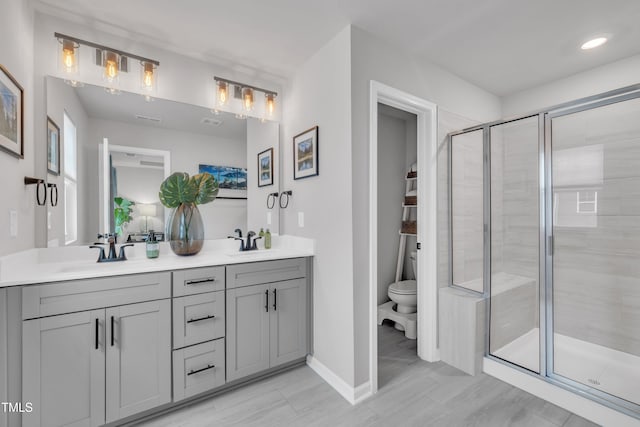 1729 Starlit Sky Ln, Cary, NC 27519 - bathroom with double vanity, a shower stall, and recessed lighting