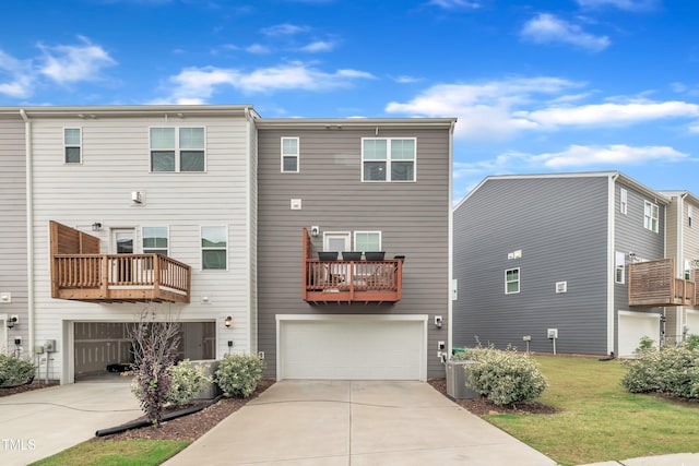 1729 Starlit Sky Ln, Cary, NC 27519 - rear view of house with concrete driveway, a garage, and a lawn