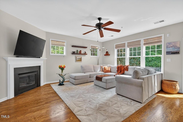 117 Sonoma Way, Chapel Hill, NC 27516 - living area featuring light wood-style floors, ceiling fan, and a glass covered fireplace
