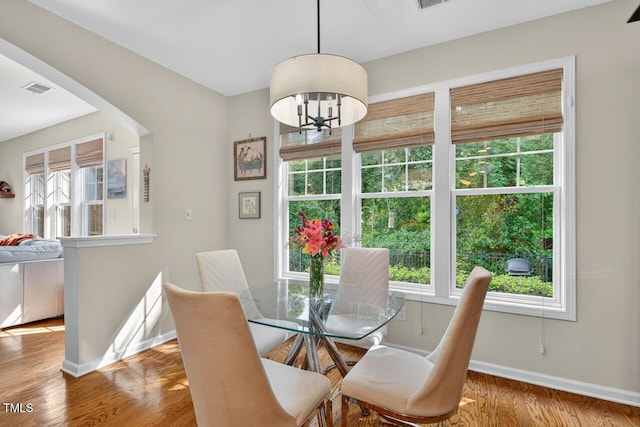 117 Sonoma Way, Chapel Hill, NC 27516 - dining space with healthy amount of natural light, a chandelier, and wood finished floors