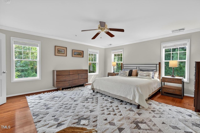 117 Sonoma Way, Chapel Hill, NC 27516 - bedroom with wood finished floors, crown molding, multiple windows, and ceiling fan