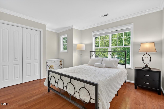 117 Sonoma Way, Chapel Hill, NC 27516 - bedroom featuring wood finished floors, a closet, and crown molding