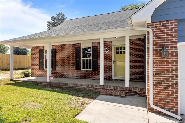 107 Beaumont Ct, Raeford, NC 28376 - entrance to property featuring brick siding, a porch, and roof with shingles